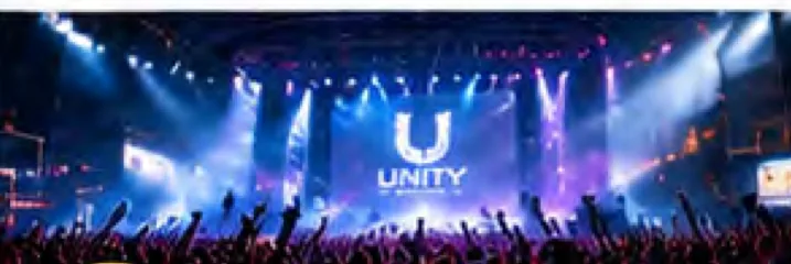 A festival crowd in front of a lit stage